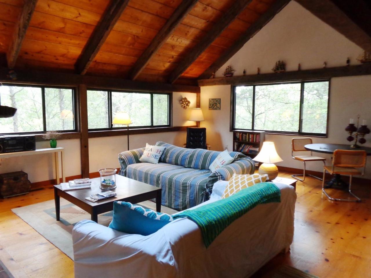 200 Gull Pond Road Wellfleet, MA 02667 - Photo 6 of 35 a living room with furniture a table and a large window