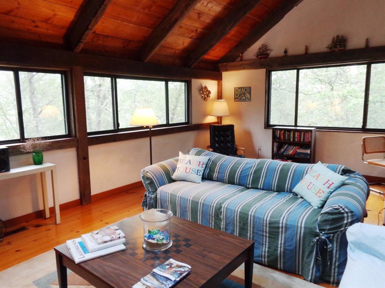 200 Gull Pond Road Wellfleet, MA 02667 - Photo 7 of 35 a living room with furniture and a large window
