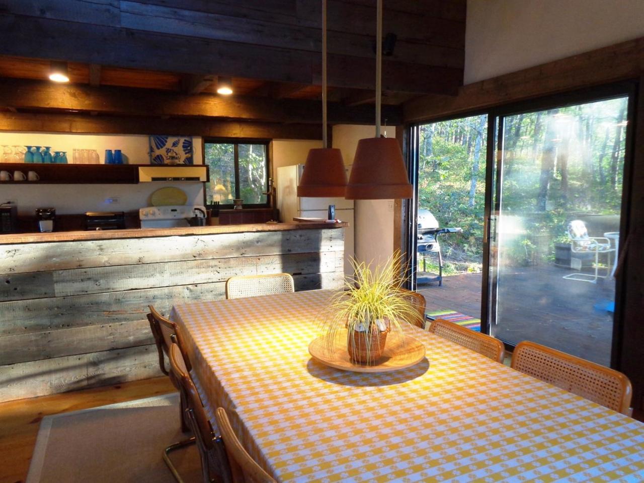 200 Gull Pond Road Wellfleet, MA 02667 - Photo 9 of 35 a kitchen with a table and chairs