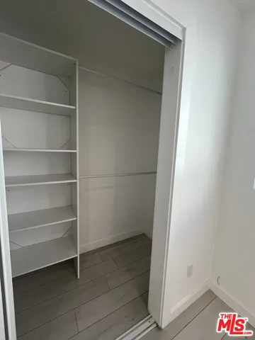 a bathroom with a toilet a sink and shower