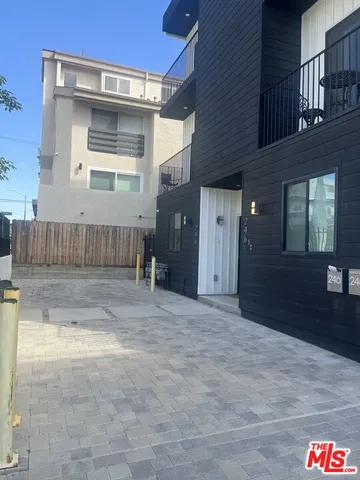 a sign board with a small yard