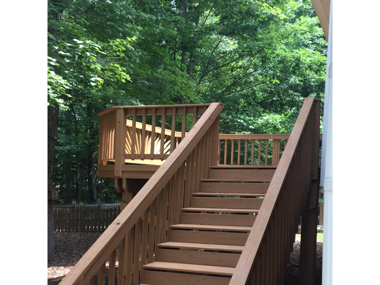 1410 Big Leaf Loop Apex, NC 27502 - Photo 11 of 20 a balcony with wooden floor and deck