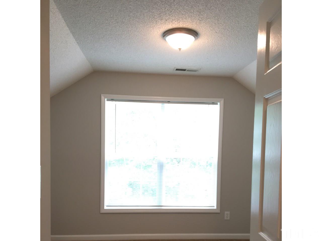 1410 Big Leaf Loop Apex, NC 27502 - Photo 16 of 20 a view of empty room with window