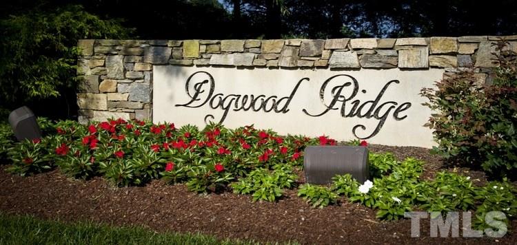 1410 Big Leaf Loop Apex, NC 27502 - Photo 17 of 20 a view of sign board with flowers