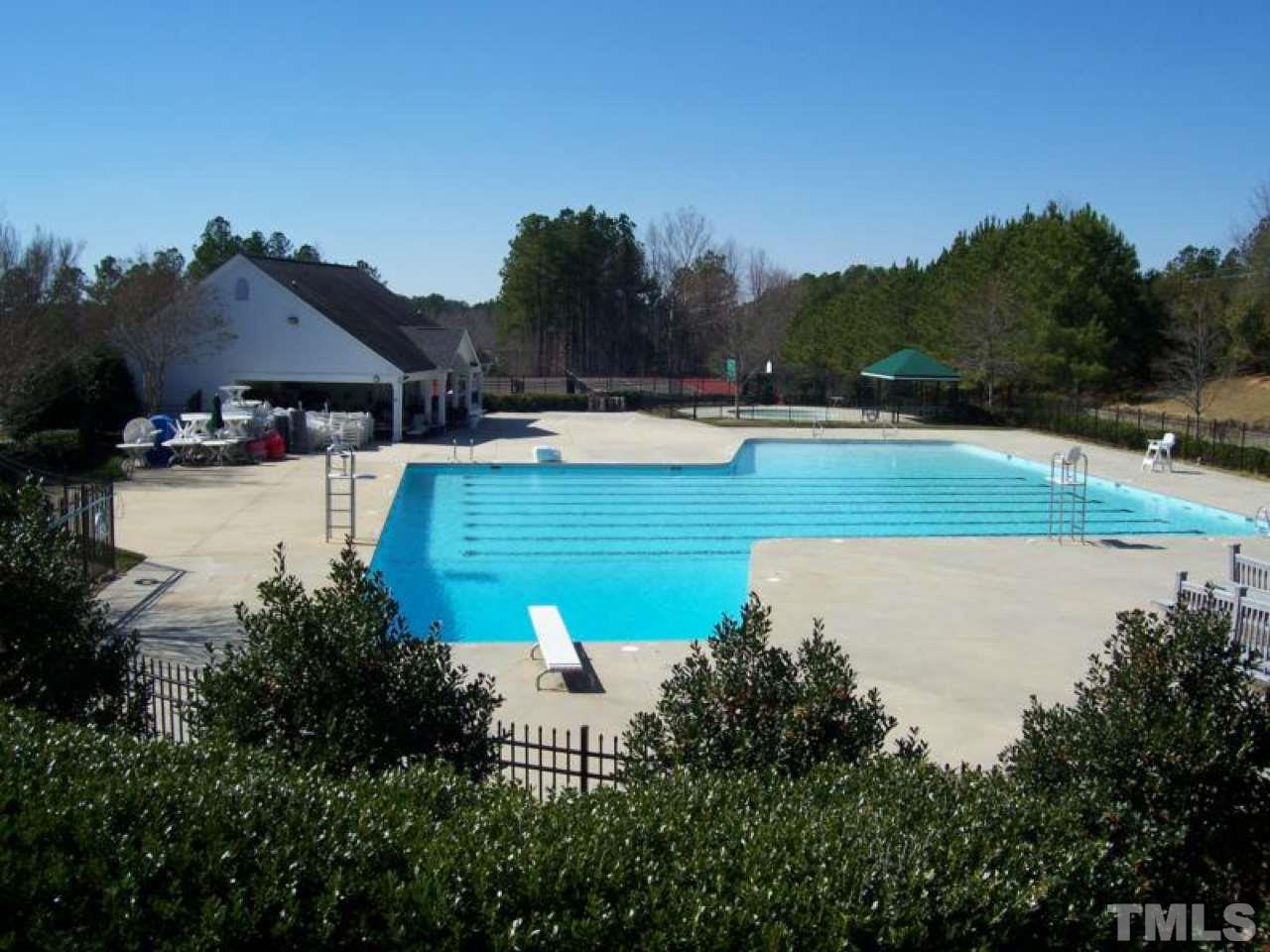 1410 Big Leaf Loop Apex, NC 27502 - Photo 19 of 20 a view of a house with pool and a yard