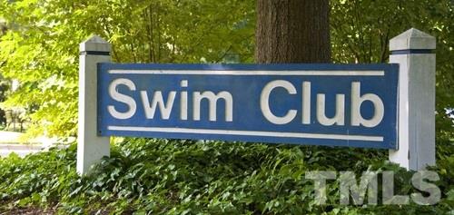 1410 Big Leaf Loop Apex, NC 27502 - Photo 20 of 20 a street sign that is on a wooden wall