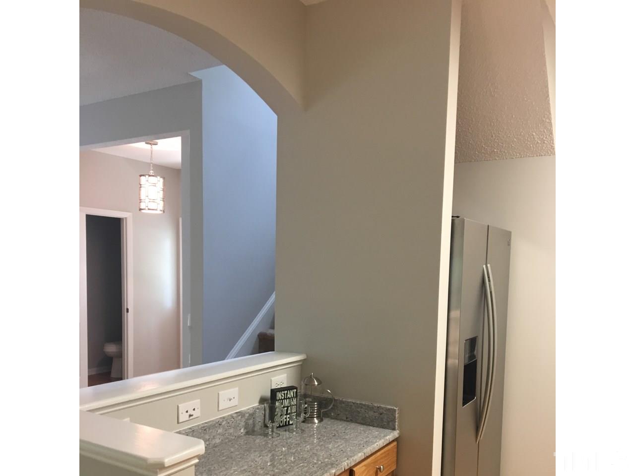 1410 Big Leaf Loop Apex, NC 27502 - Photo 4 of 20 a bathroom with a sink and a mirror