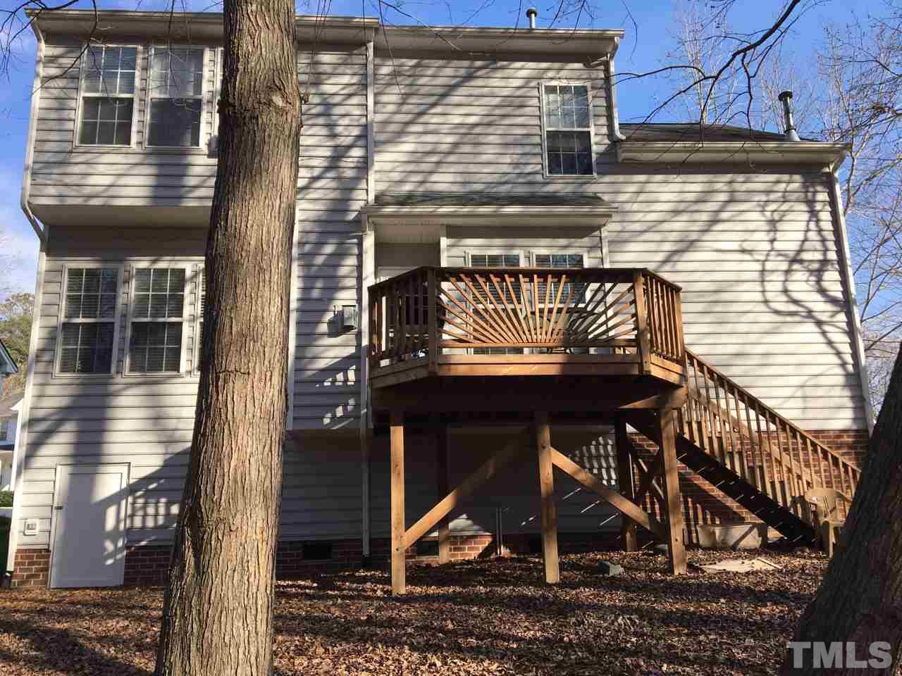 1410 Big Leaf Loop Apex, NC 27502 - Photo 10 of 20 a view of a brick house with a small yard
