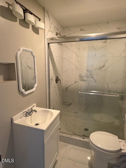 1899 Stewart Farm Road Henderson, NC 27537 - Photo 18 of 27 a bathroom with a sink a mirror a toilet and a shower