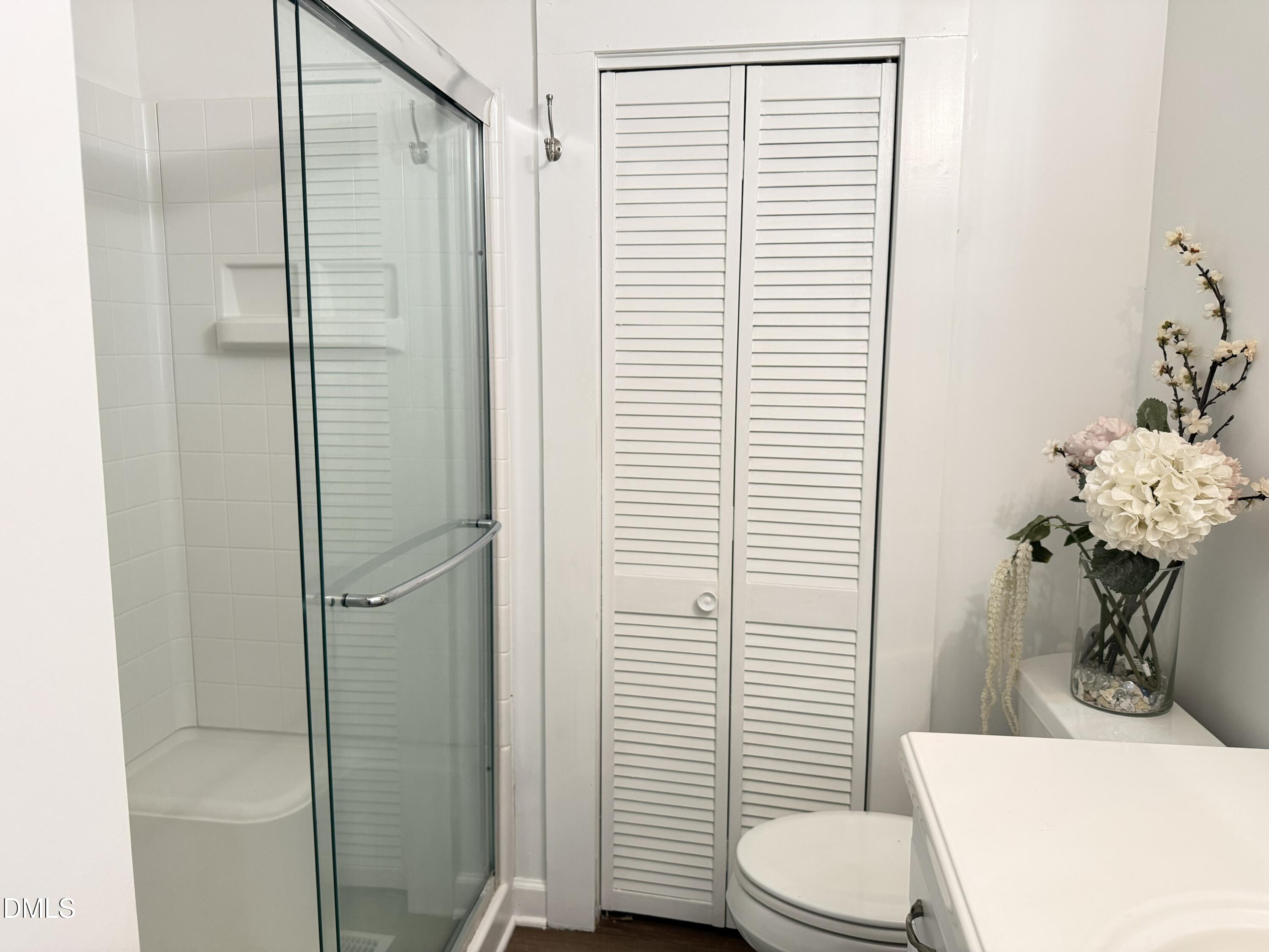 1899 Stewart Farm Road Henderson, NC 27537 - Photo 20 of 27 a bathroom with a sink a toilet and shower
