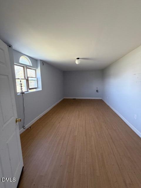 1899 Stewart Farm Road Henderson, NC 27537 - Photo 24 of 27 an empty room with wooden floor and windows