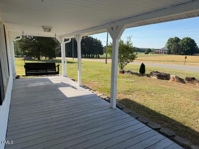 1899 Stewart Farm Road Henderson, NC 27537 - Photo 3 of 27 a view of a balcony with wooden floor