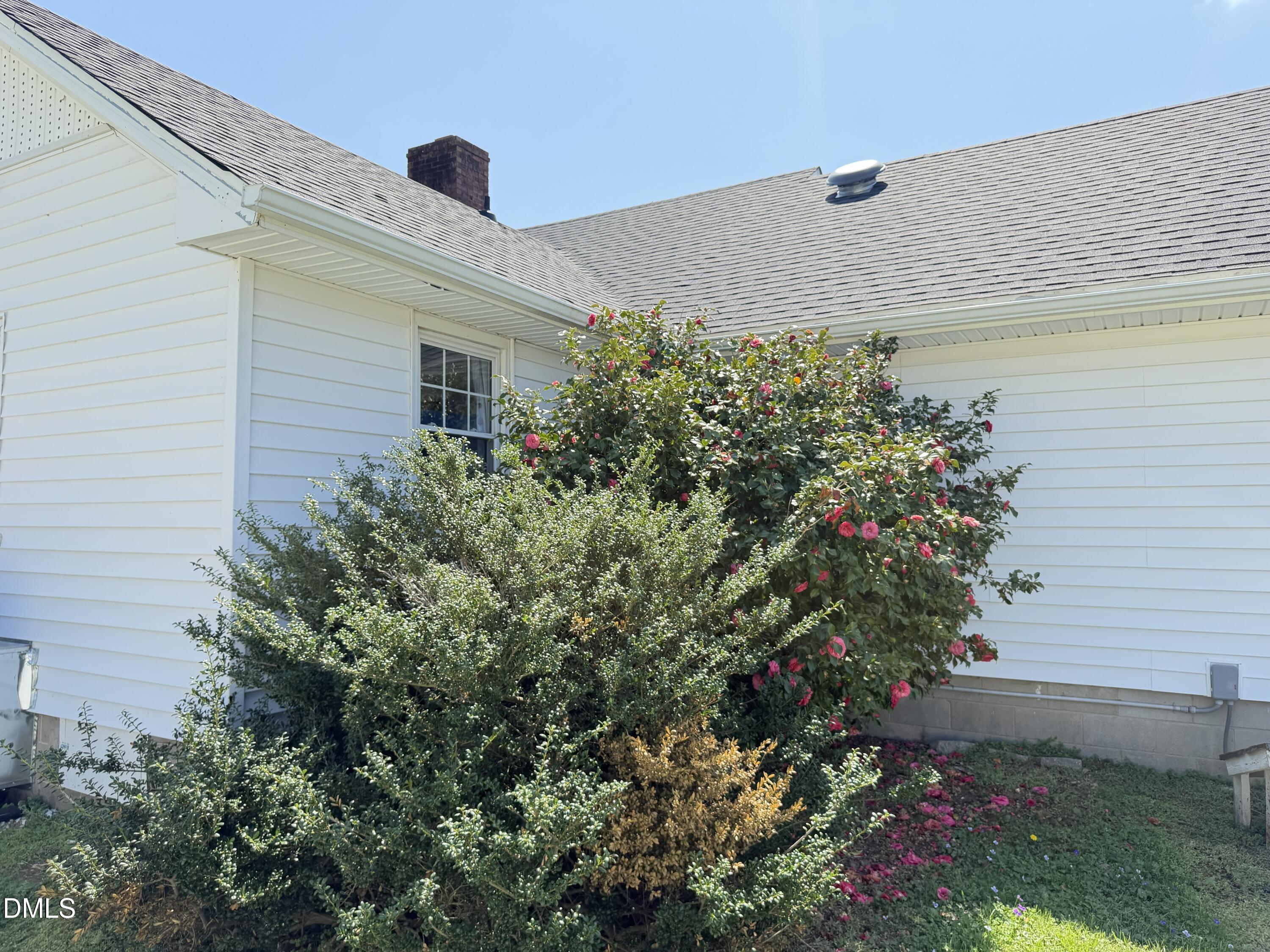 1899 Stewart Farm Road Henderson, NC 27537 - Photo 4 of 27 a house with a flower garden