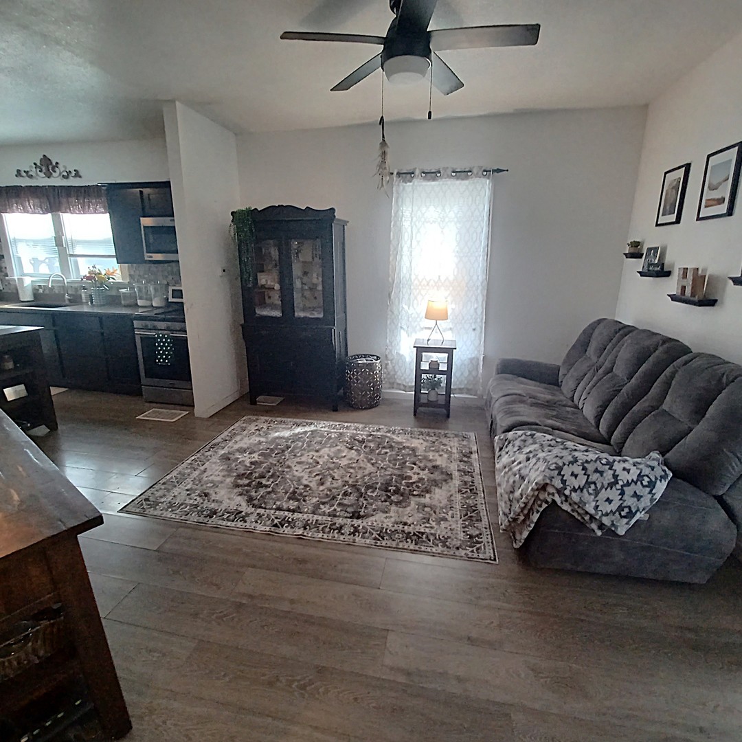 122 South Beach Street Kewanee, IL 61443 - Photo 23 of 49 a living room with furniture and a fireplace