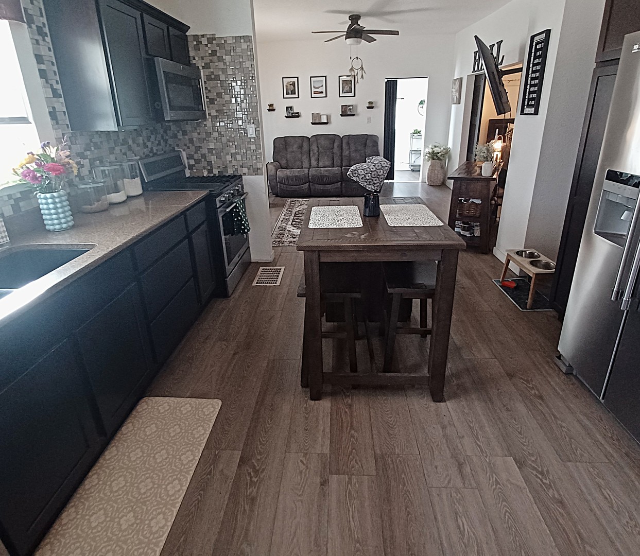 122 South Beach Street Kewanee, IL 61443 - Photo 29 of 49 a kitchen with sink cabinets and wooden floor