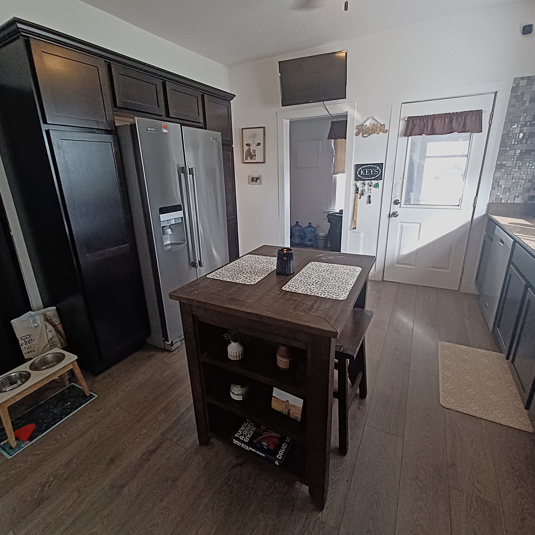 122 South Beach Street Kewanee, IL 61443 - Photo 31 of 49 a view of a dining room with furniture wooden floor and a refrigerator