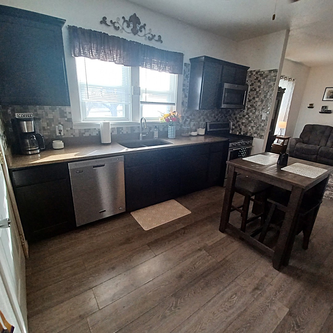 122 South Beach Street Kewanee, IL 61443 - Photo 33 of 49 a kitchen with a sink appliances and cabinets