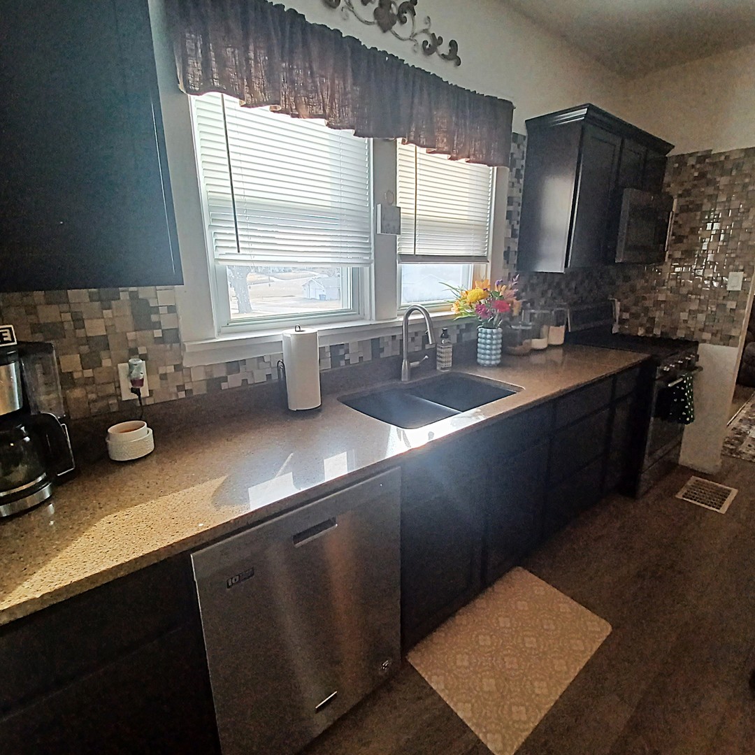 122 South Beach Street Kewanee, IL 61443 - Photo 34 of 49 a kitchen with a sink a window and cabinets