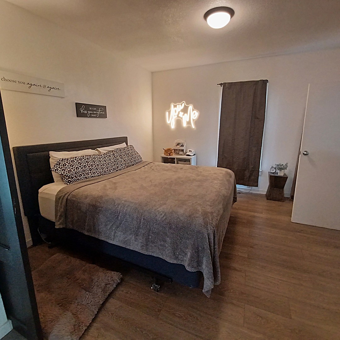 122 South Beach Street Kewanee, IL 61443 - Photo 36 of 49 a bedroom with a bed and a mirror