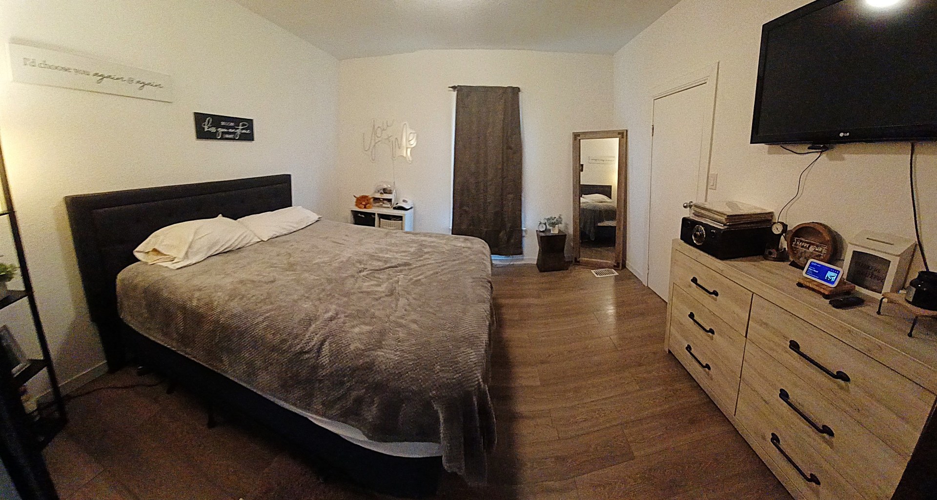 122 South Beach Street Kewanee, IL 61443 - Photo 37 of 49 a bed room with a bed and a flat tv screen on a dresser