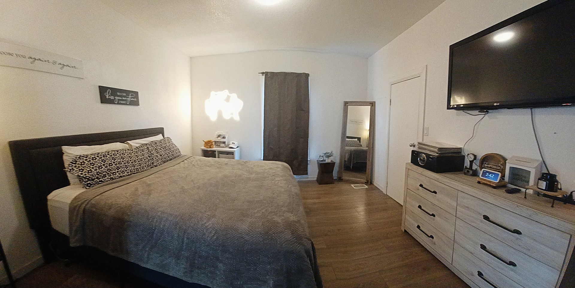 122 South Beach Street Kewanee, IL 61443 - Photo 39 of 49 a spacious bedroom with a bed and a flat screen tv