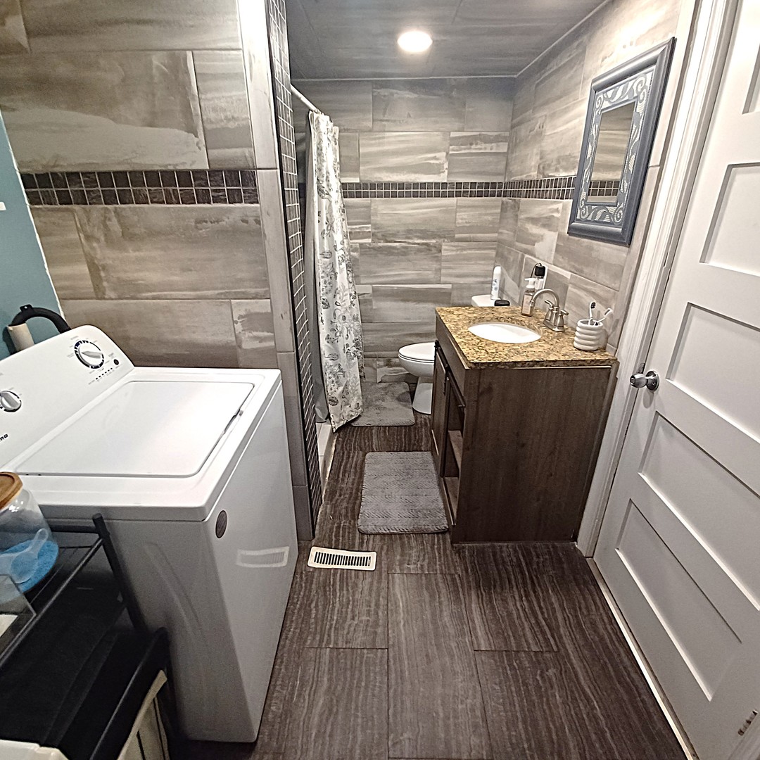 122 South Beach Street Kewanee, IL 61443 - Photo 44 of 49 a bathroom with a sink toilet and shower