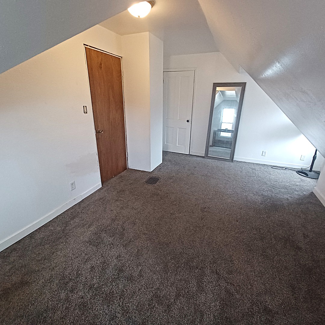 122 South Beach Street Kewanee, IL 61443 - Photo 48 of 49 an empty room with closet and mirror