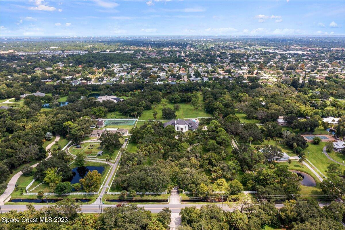2815 Turtle Mound Road Melbourne, FL 32934 - Photo 112 of 115 an aerial view of residential building with green space