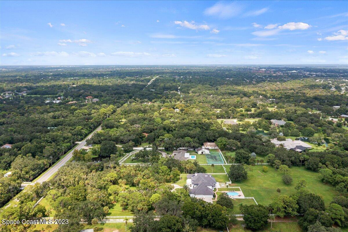 2815 Turtle Mound Road Melbourne, FL 32934 - Photo 114 of 115 an aerial view of residential houses with outdoor space and trees