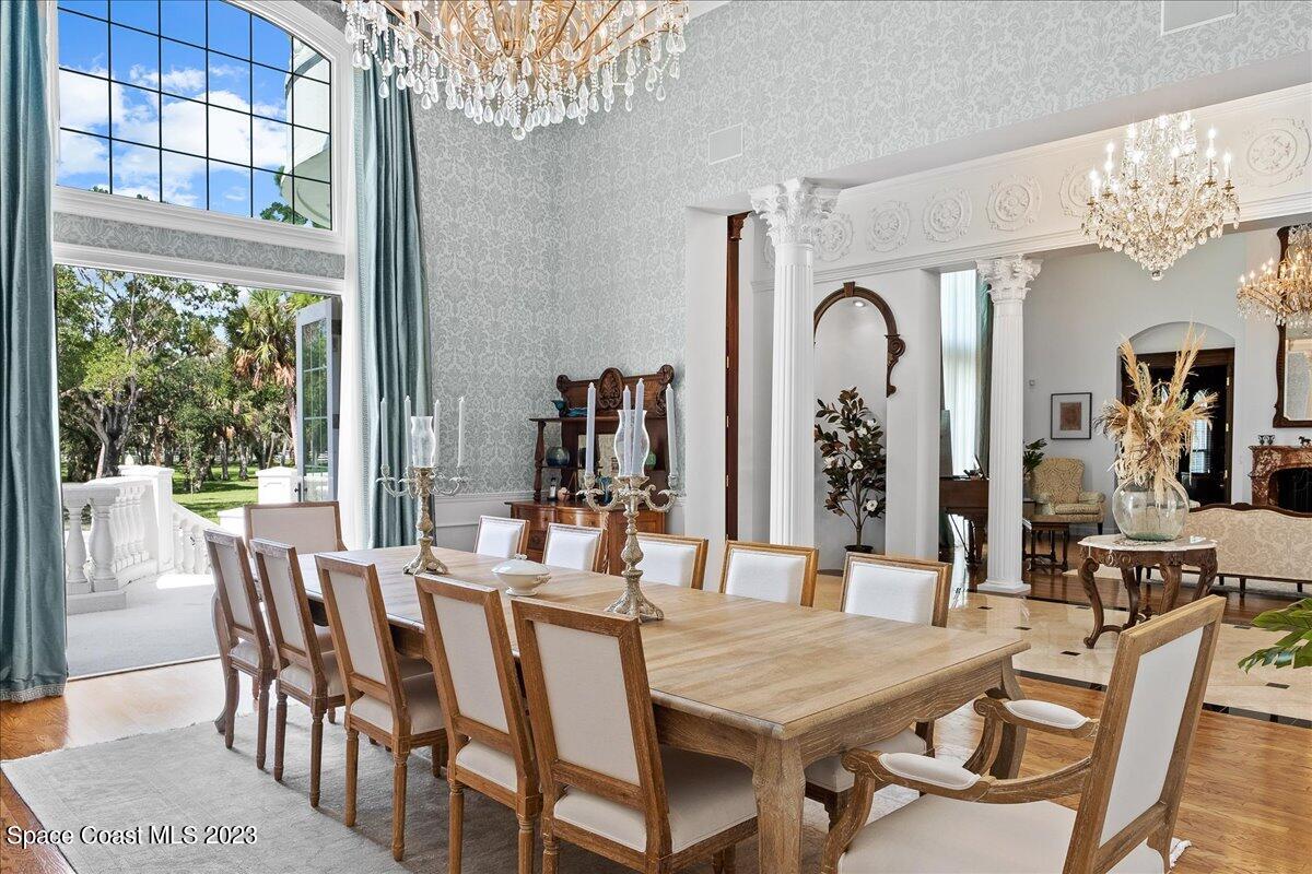 2815 Turtle Mound Road Melbourne, FL 32934 - Photo 14 of 115 a view of a dining room with furniture window and wooden floor