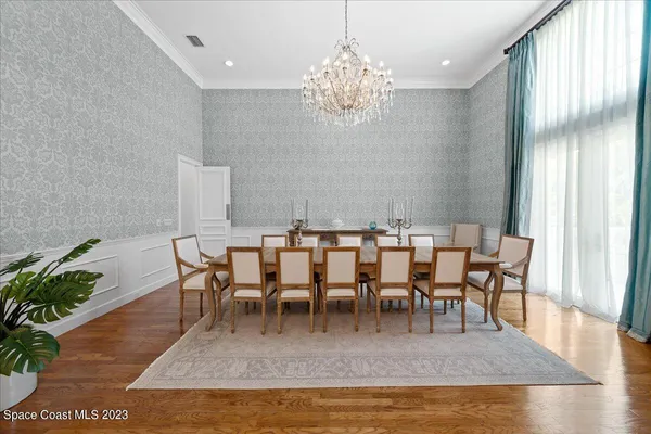 a kitchen with granite countertop stainless steel appliances a stove and a white cabinets