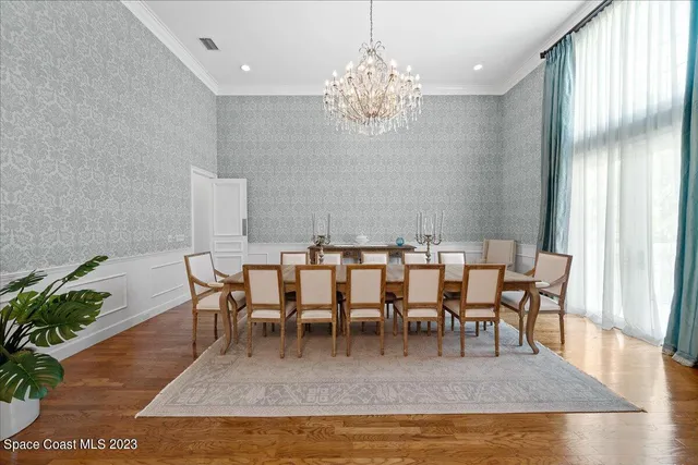 a kitchen with granite countertop stainless steel appliances a stove and a white cabinets