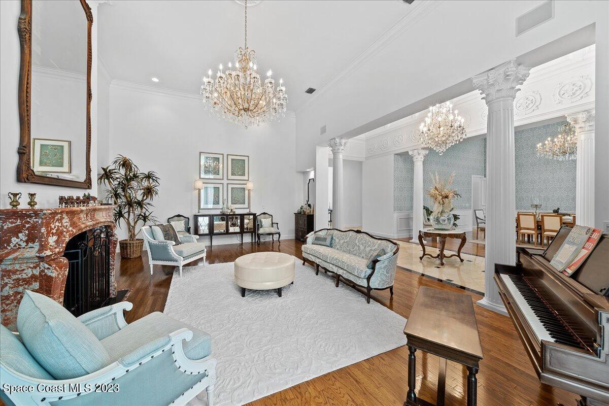 2815 Turtle Mound Road Melbourne, FL 32934 - Photo 20 of 115 a living room with furniture and a chandelier