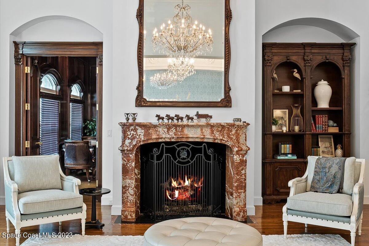 2815 Turtle Mound Road Melbourne, FL 32934 - Photo 23 of 115 a living room with furniture and a fireplace