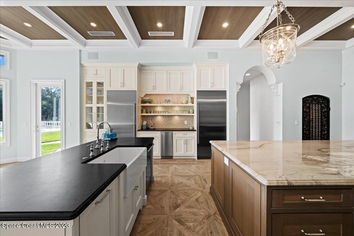 2815 Turtle Mound Road Melbourne, FL 32934 - Photo 32 of 115 a kitchen with stainless steel appliances granite countertop a sink a stove and a refrigerator