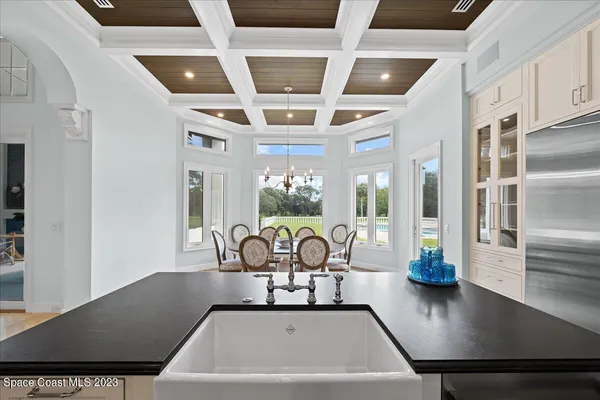 a bathroom with a sink a mirror and a window