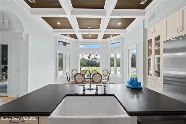a bathroom with a sink a mirror and a window