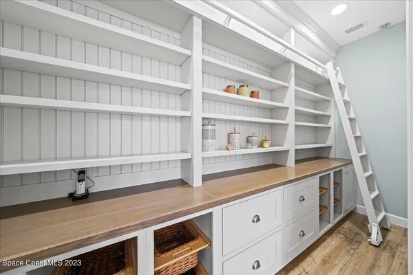 a view of a house with a backyard porch and sitting area