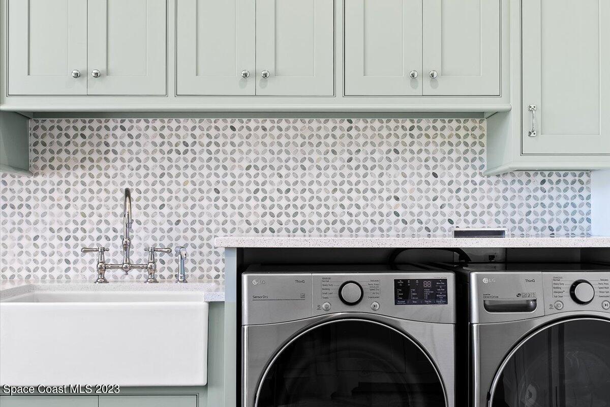 2815 Turtle Mound Road Melbourne, FL 32934 - Photo 38 of 115 a close view of a utility room with dryer and washer