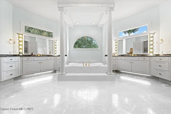 an aerial view of residential building with green space