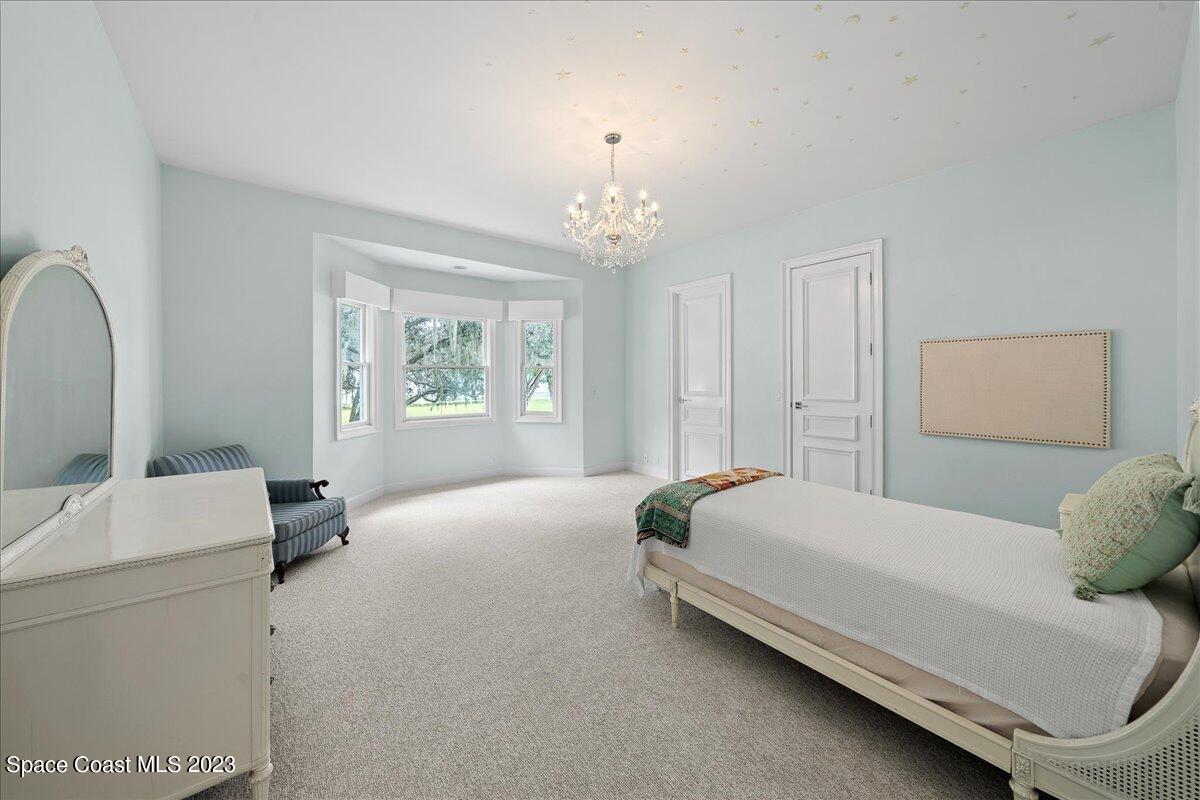 2815 Turtle Mound Road Melbourne, FL 32934 - Photo 70 of 115 a bedroom with a bed and a window