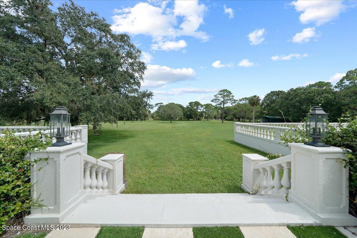 2815 Turtle Mound Road Melbourne, FL 32934 - Photo 93 of 115 a view of a chair and table of the garden