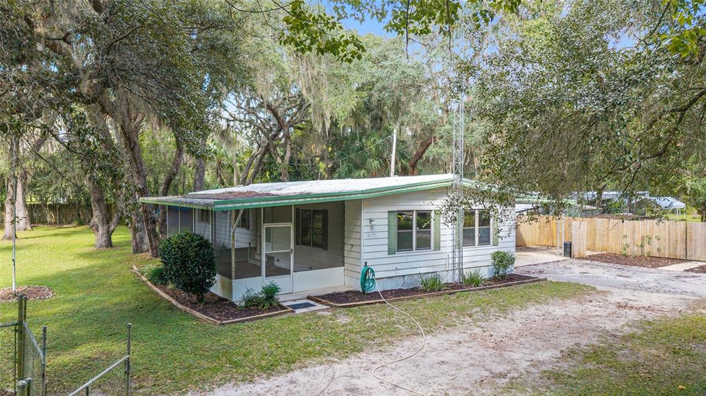 18395 Northwest 4th Terrace Citra, FL 32113 - Photo 11 of 66 a view of a house with backyard and a tree