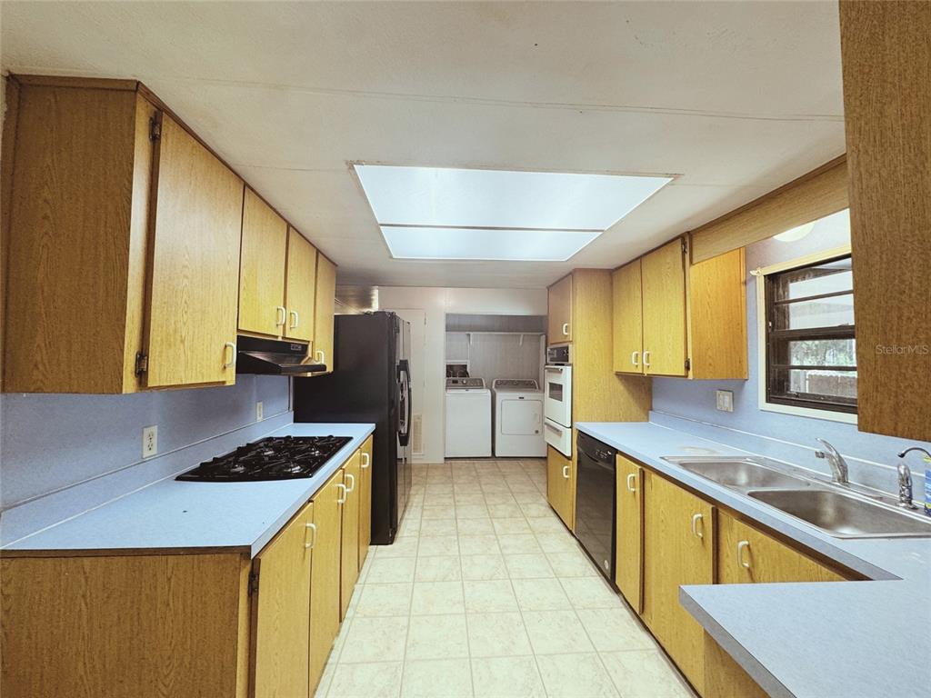 18395 Northwest 4th Terrace Citra, FL 32113 - Photo 17 of 66 a kitchen with stainless steel appliances granite countertop a sink and cabinets
