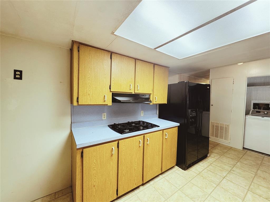 18395 Northwest 4th Terrace Citra, FL 32113 - Photo 18 of 66 a kitchen with stainless steel appliances granite countertop a refrigerator a stove and a sink
