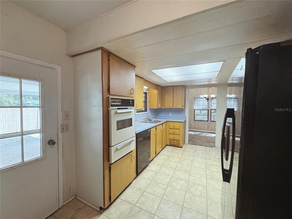 18395 Northwest 4th Terrace Citra, FL 32113 - Photo 19 of 66 a large kitchen with a refrigerator and a stove