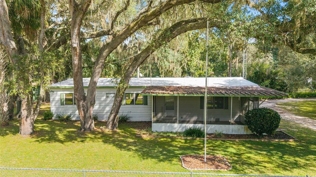 18395 Northwest 4th Terrace Citra, FL 32113 - Photo 2 of 66 a front view of a house with a yard