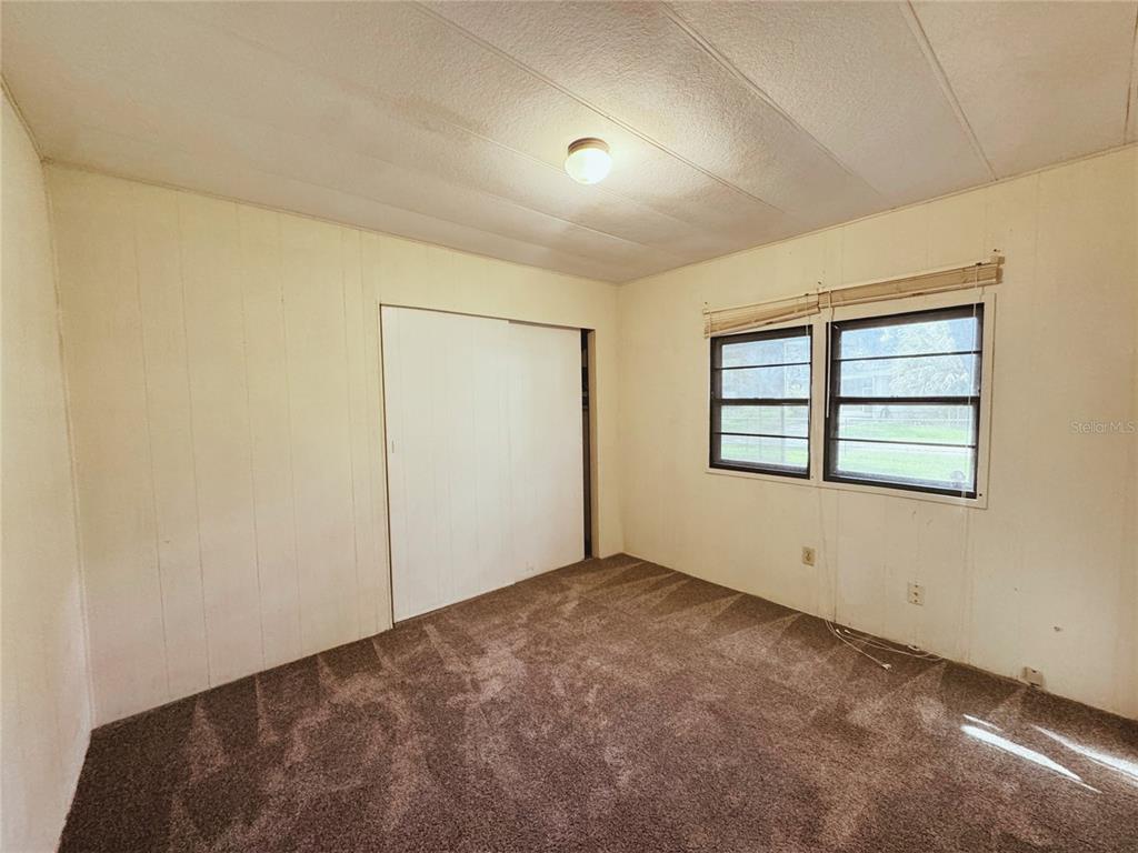 18395 Northwest 4th Terrace Citra, FL 32113 - Photo 23 of 66 a view of an empty room with windows