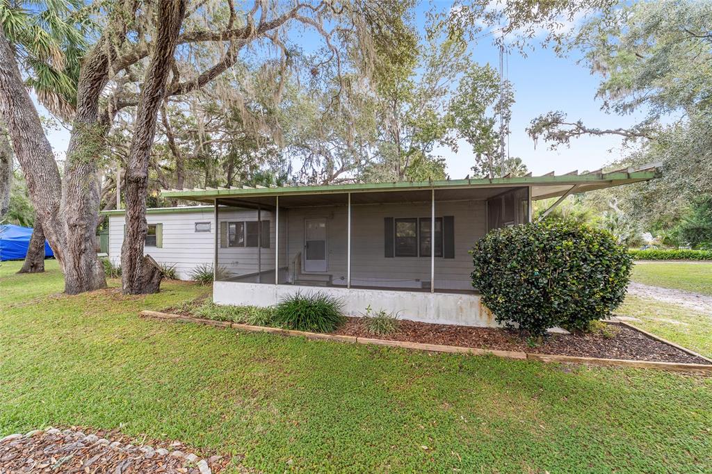 18395 Northwest 4th Terrace Citra, FL 32113 - Photo 45 of 66 a front view of a house with garden