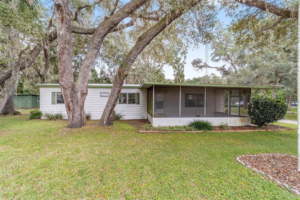 18395 Northwest 4th Terrace Citra, FL 32113 - Photo 46 of 66 a front view of a house with a yard and garage